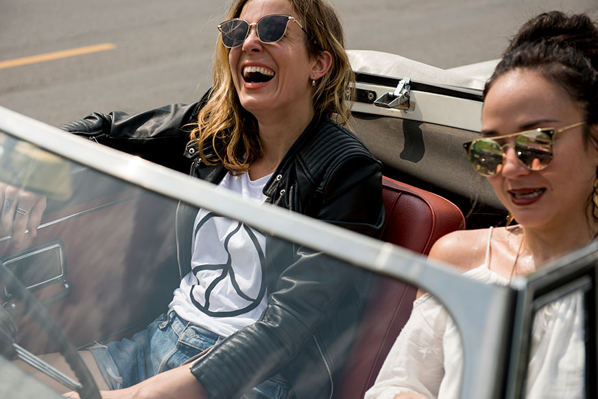 two-women-having-fun-driving