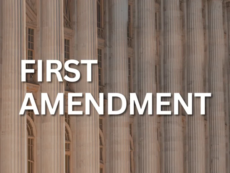 A building with columns showcasing the words "First Amendment" prominently, emphasizing its constitutional significance.
