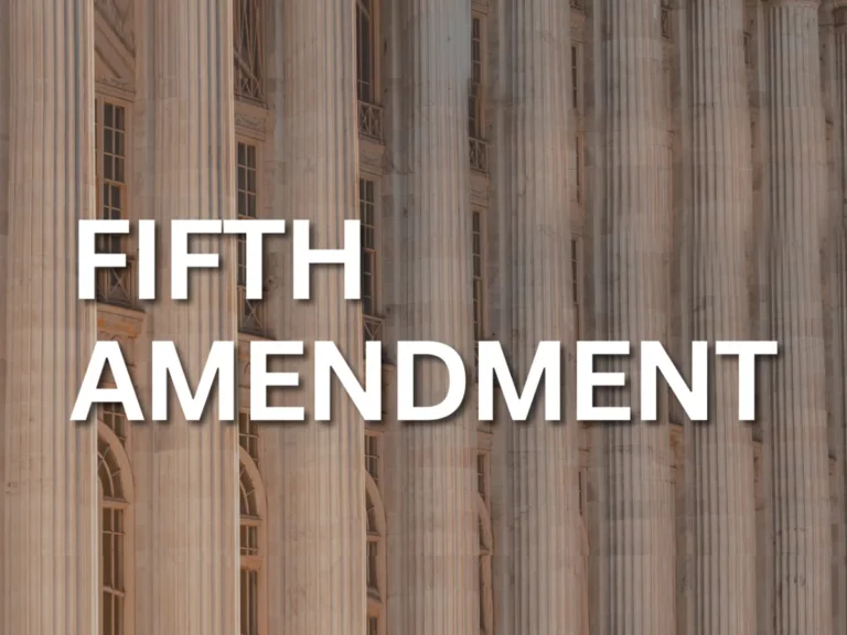 A constitutional building with columns featuring the words fifth amendment.