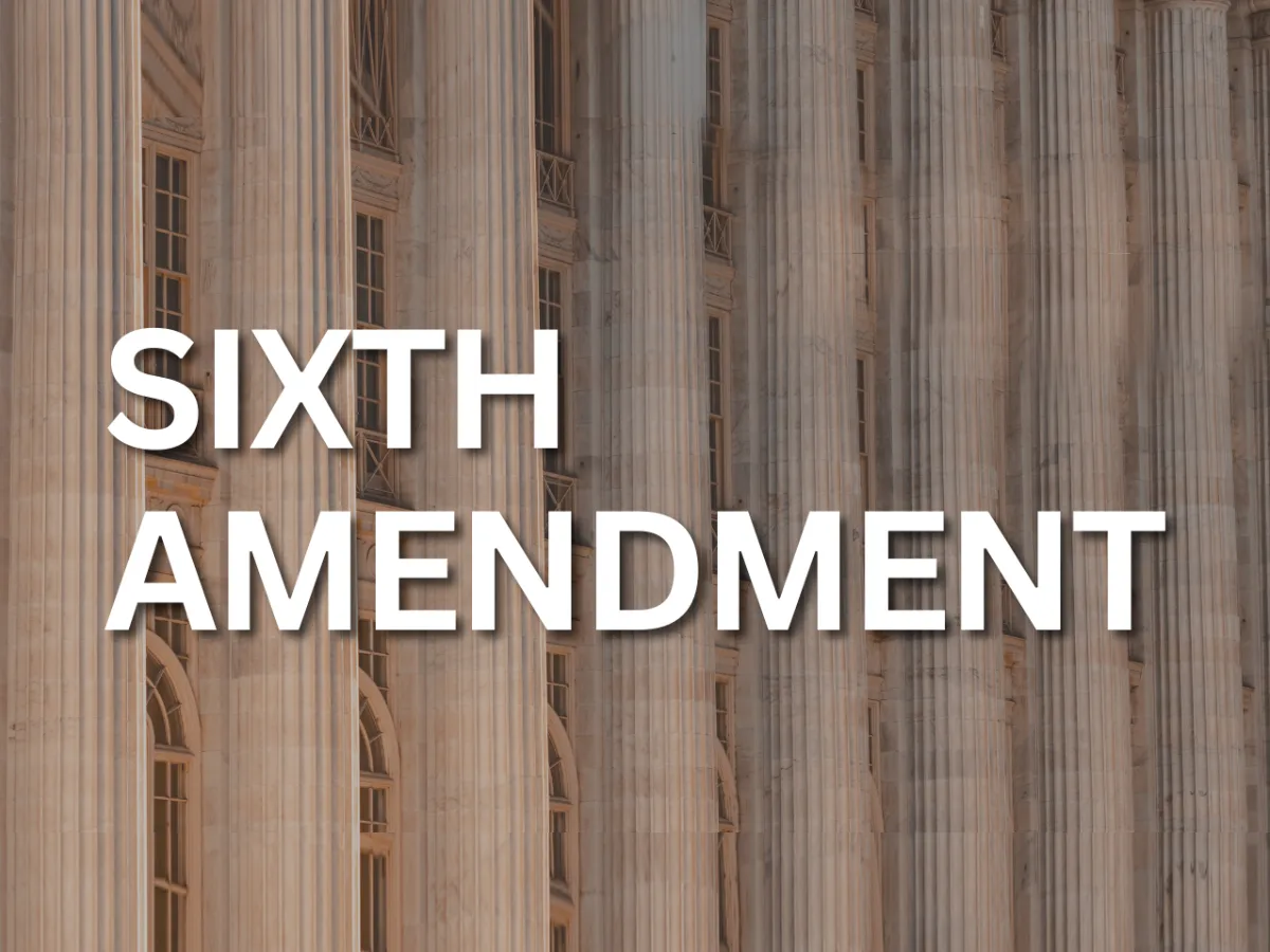 A building with columns displaying the words "sixth amendment" prominently, where individuals accused of a misdemeanor can seek legal counsel from a lawyer.