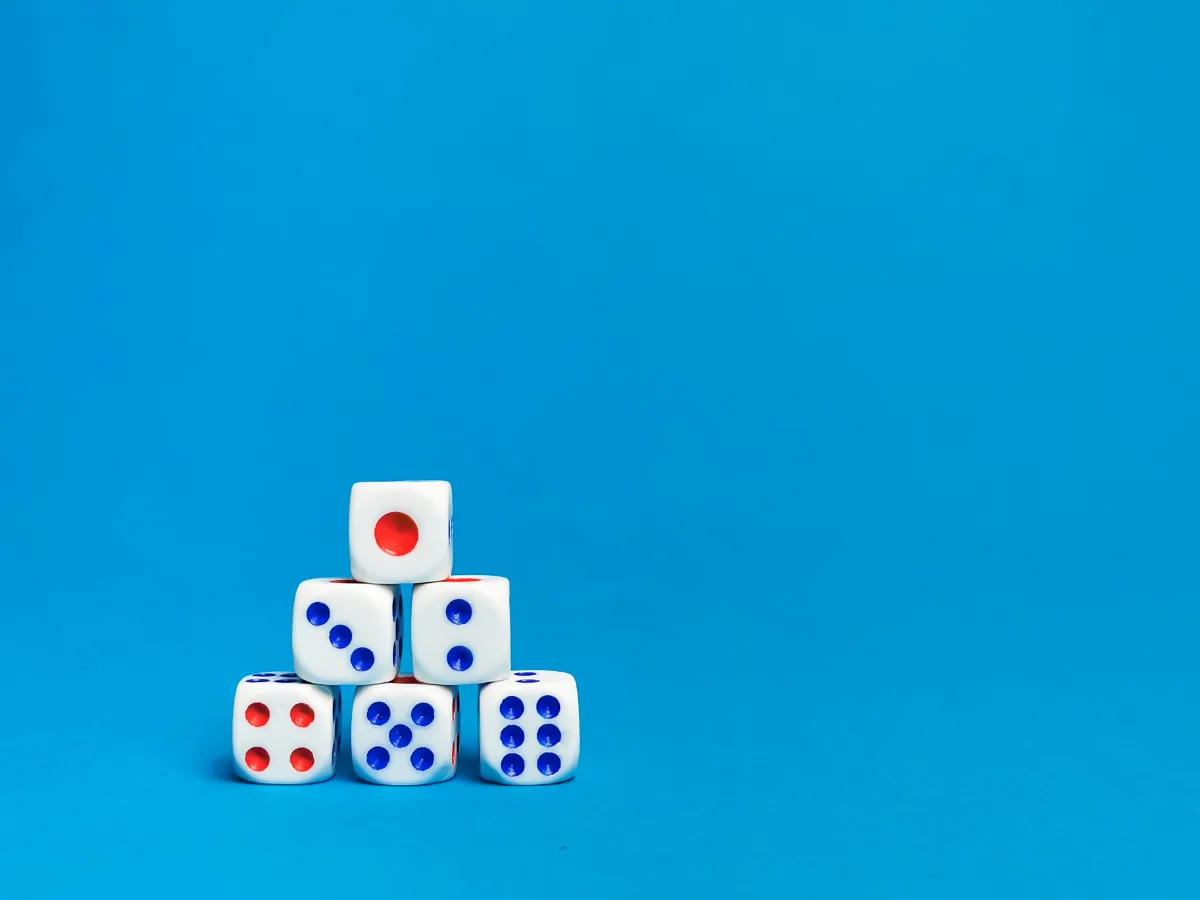 A stack of dice on a blue background.