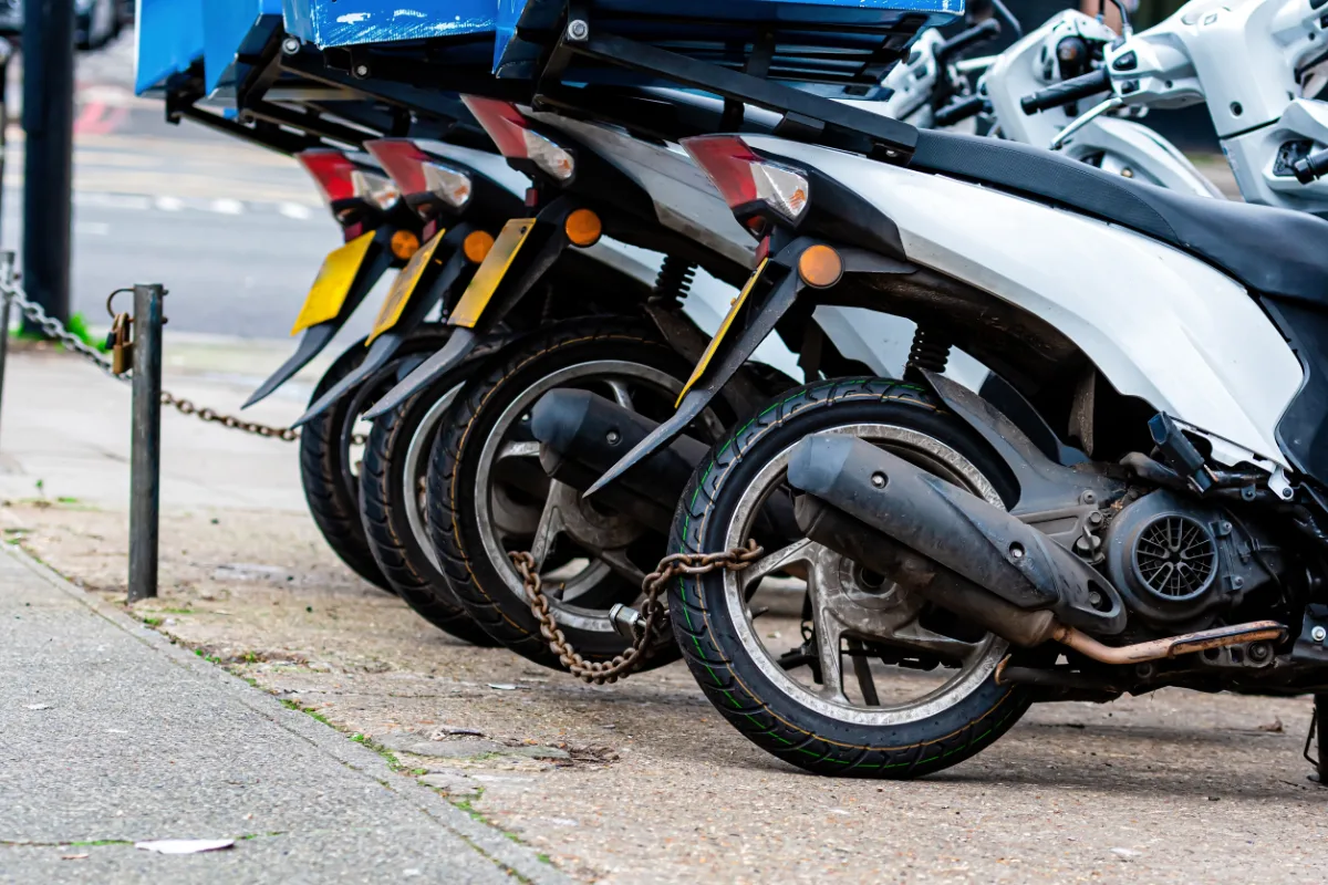 A row of motorcycles parked next to each other.