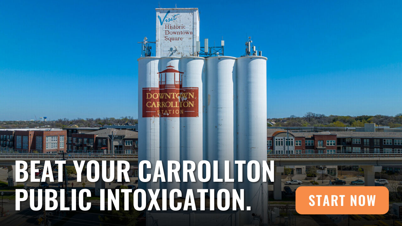 White industrial silos with the "Downtown Carrollton Station" sign stand near buildings, with a text overlay offering legal help for Public Intoxication In Carrollton and a "Start Now" button.